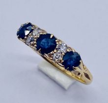 A sapphire and diamond 7 stone ring set in 18ct gold