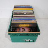 A large quantity of 12" vinyl records, including The Bee Gees, Elvis Presley, Glen Campbell, Frank