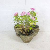 Three reconstituted stone garden pots