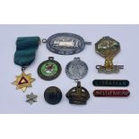 A small collection of badges and medallions including Librarian and Longleat Railway enamelled