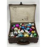 A collection of vintage Christmas Decorations in leather case