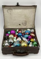 A collection of vintage Christmas Decorations in leather case