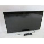 A Panasonic 40 inch TV with remote