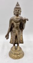 A bronze standing buddha, height 32cm approx.