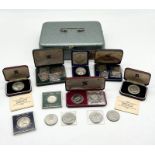 A collection of coin sets and commemorative coins including 1966 Jersey five shilling set and