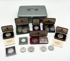 A collection of coin sets and commemorative coins including 1966 Jersey five shilling set and
