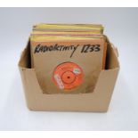 A collection of rock and pop 7" promotional/demonstration vinyl records, including Kraftwerk, Don