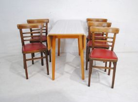 A retro drop-leaf table along with a set of five chairs marked 'Chair Centre Limited' of London