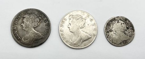 Two Queen Anne half crowns dated 1709 and 1707 along with a 1708 shilling