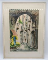 A framed watercolour of a street scene, with indistinct signature - 78cm x 58cm