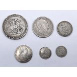 A collection of George III and IV silver coinage including 1819 Crown, 1836 half crown, 1826