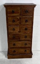 A hardwood narrow chest of ten drawers. 61cm x 33cm, height 120cm