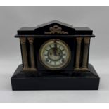 A Victorian slate mantle clock