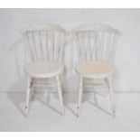 A pair of white painted penny chairs