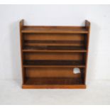 An oak freestanding bookcase - length 103.5cm, depth 30cm, height 109cm