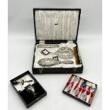 A cased hallmarked silver dressing table set along with a silver plated christening set etc.