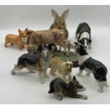 A collection of dog figurines including a Beswick Corgi, Melba Ware etc along with a Juliana
