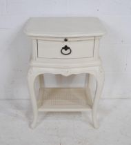 A Wills & Gambier telephone table, with brush slide and single drawer, raised on cabriole legs -