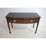 An antique mahogany bow-fronted side table, with single drawer, raised on tapering legs- length