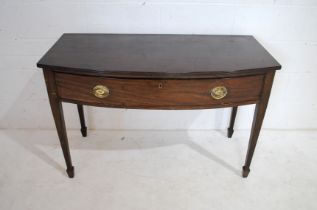 An antique mahogany bow-fronted side table, with single drawer, raised on tapering legs- length