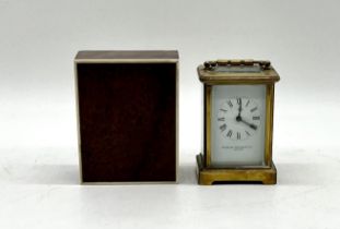 A carriage clock by Stewart Dawson & co Ltd of London with key 8cm x 6.5cm, height 14cm. Lot also