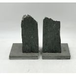 A pair of book ends, made of stone, possibly slate ?