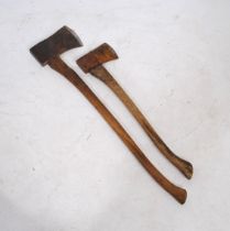 Two vintage axes, with wooden handles and broad arrow marks