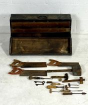 A vintage wooden tool chest marked E.D, with a small selection of woodworking tools.
