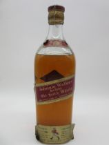 A large sealed bottle of vintage Johnnie Walker red Label whisky, no ABV or bottle size, height of