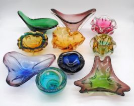 A collection of art glass vases and bowls, including an orange Sommerso Chribska bowl, a red vase by