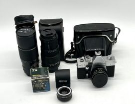 A Praktica MTL3 camera plus a Sigma DC zoom lens, a Super Carenar MC lens and a Prinzflex x2