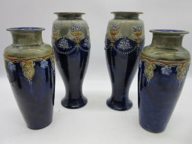 Two pairs of Royal Doulton vases, measuring 29cm height and 25cm, hairline crack to rim of taller