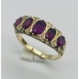 A 9ct gold ruby 5 stone ring