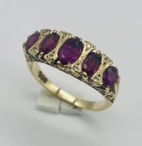 A 9ct gold ruby 5 stone ring