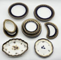 A Royal Worcester cobalt and gilt part dinner service along with two Royal Worcester scalloped