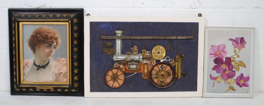 Three framed pictures, including a steampunk style collage of a steam engine, a framed portrait of a