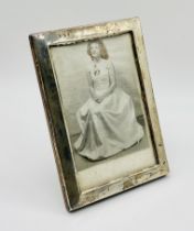 A silver photo frame, 15cm x 10cm