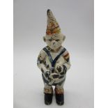 A small cast iron clown money box, with painted decoration and slot to reverse - height 14cm