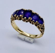 An amethyst five stone ring set in 9ct gold