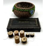 A vintage ebonised Crotchet box along with a wicker sewing basket and various cotton reels.