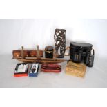 A mixed lot, including wooden tribal carvings, cased binoculars, puzzle box etc.