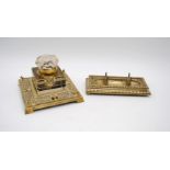 A cut glass inkwell on ornate brass stand, along with a brass pen holder marked 'HP' to the