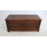 An oak blanket box, with carved decoration - length 107cm, depth 46cm, height 47cm