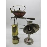 A "Protector Lamp & Lighting Co." miners lamp (no glass) along with a copper kettle, trivet (A/F)