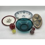 An assortment of three ceramic plates, three pieces of art glass including a turquoise bowl, plus