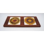A mid century cheeseboard inset with two Alan Wallwork tiles - one cracked - length 5.5cm, depth
