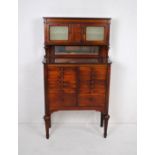 An inlaid mahogany dentist's cabinet, with seventeen tin lined drawers and three small cupboards and