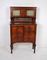 An inlaid mahogany dentist's cabinet, with seventeen tin lined drawers and three small cupboards and