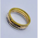 An 18ct tri colour gold wedding band set with diamonds (size G 1/2), weight 3.6g