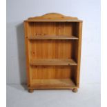 A pine freestanding bookcase - length 77cm, depth 30cm, height 116.5cm